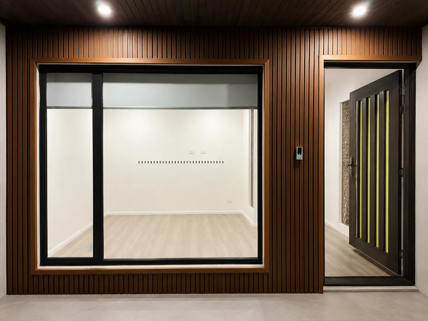 Timber batten wall surrounding a modern entry door