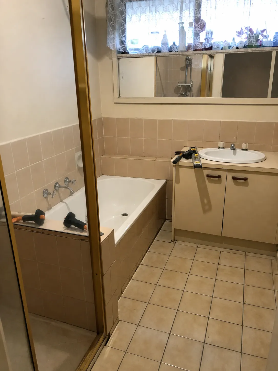 Older bathroom before its warm neutral renovation